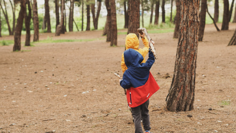 Children playing outdoors after getting autism coaching